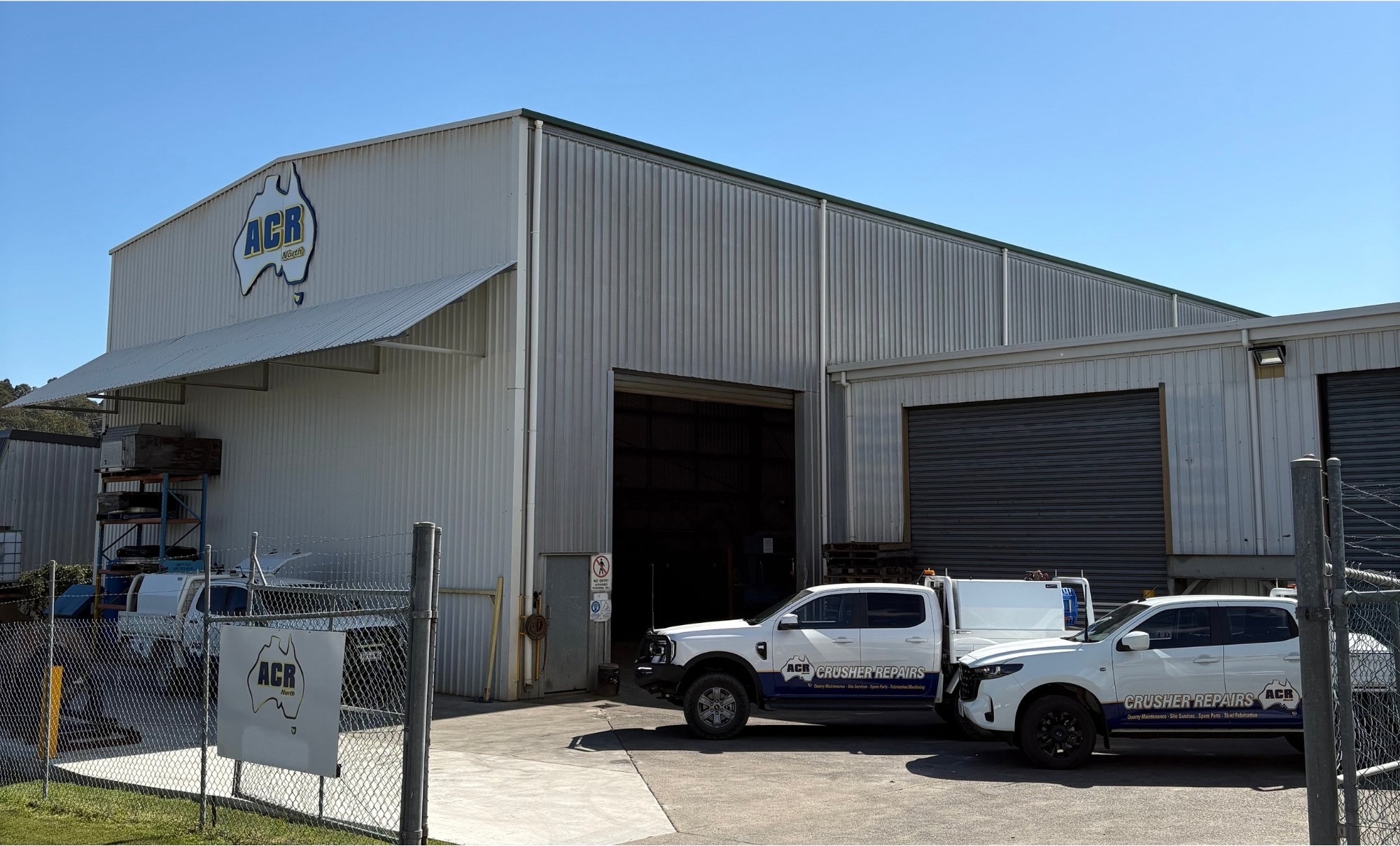 The front of the ACR North workshop in Beenleigh with service utes parked outside